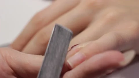 Removing the gel coating from the nails Stock Footage 149122135