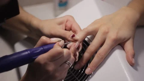 Removing the gel coating from the nails Stock Footage 149122523