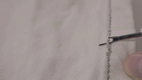 Removing gray thread with seam ripper 스톡 동영상 339897648