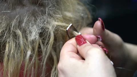 Removing hair extensions Stock Footage 149297824