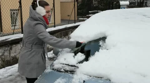 Removing ice from the car windshield,. Stock Footage 20995041