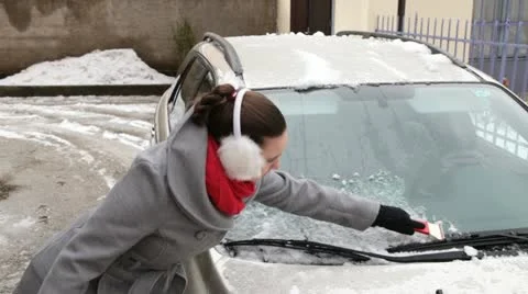 Removing ice from the car windshield. Stock Footage 20996663