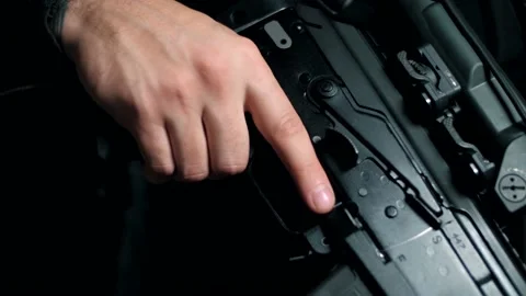 Removing the Kalashnikov machine from the fuse. Close-up Stock Footage 144069612