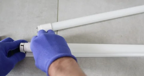 Removing an LED lamp Stock Footage 318020523