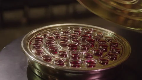 Removing the Lid of a Communion Wine Plate Stockbeeldmateriaal 208802018