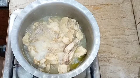 Removing Lid from Pot with Tender Boiling Chicken in Broth, Meal Preparation Stock Footage 323351884