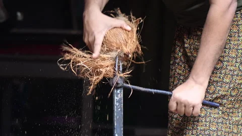 Removing mesocarp of from half de husked coconut using an equipment. Video stock 278450094