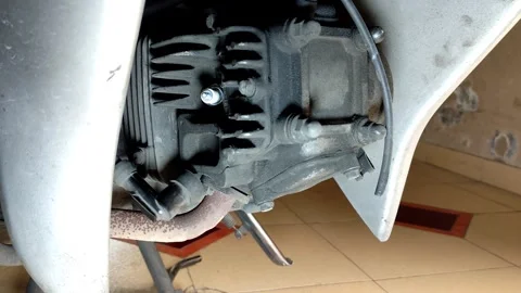 Removing Motorcycle Spark Plug with Wrench for Engine Maintenance Stock Footage 321796673