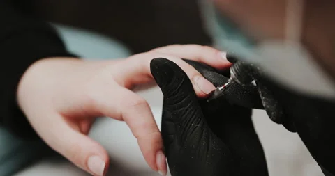 Removing the nail plate with a milling machine. Manicure process in beauty salon Video stock 149365144