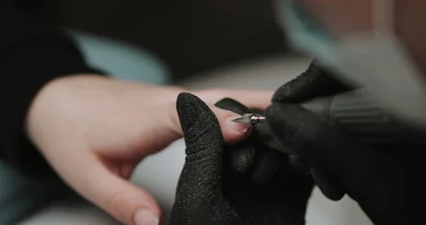 Removing the nail plate with a milling machine. Manicure process in beauty salon Video stock 149365237