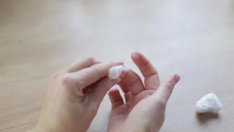 Removing nail polish using product and cotton wool Video stock 266898530