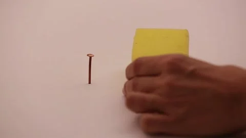 Removing a nail with the sponge 1 Stock Footage 132218905