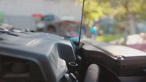 Removing the oil dipstick from the engine to check the engine oil level. Slow Stock Footage 255632429