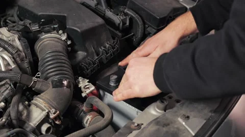 Removing old battery from car Stock Footage 155662265
