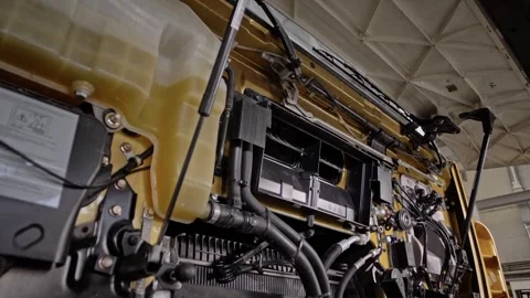 Removing an old cargo truck engine air filter at a truck repair facility. Stock Footage 261289622
