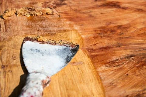 Removing old paint using a solvent and a trowel, renovation of wood surface Stock Photos