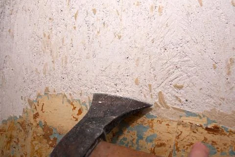 Removing the old paint from the wall Stock Photos