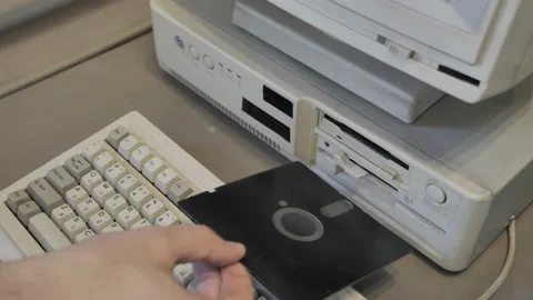 Removing An Old-style Floppy Disk Stock Footage 157961079