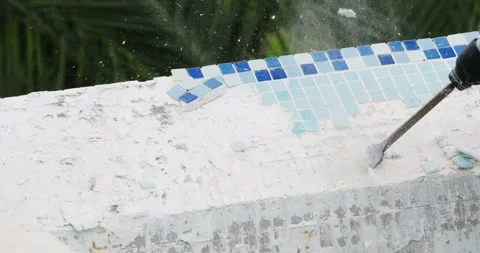 Removing old tile in swimming pool. Pool repairing work. Close-up. Video stock 275005042
