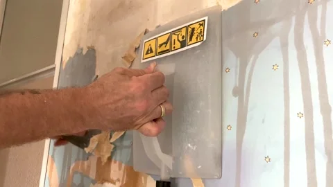 Removing old wallpaper with steamer and scraper 動画素材 247633209