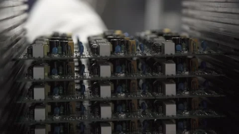 Removing one circuit board from the circuit board holder. Close-up Stock Footage 211817846