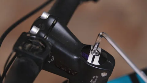 Removing or replacing a bicycle handlebar stem Stock Footage 280491897