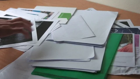 Removing papers from Table Stock Footage 91269955