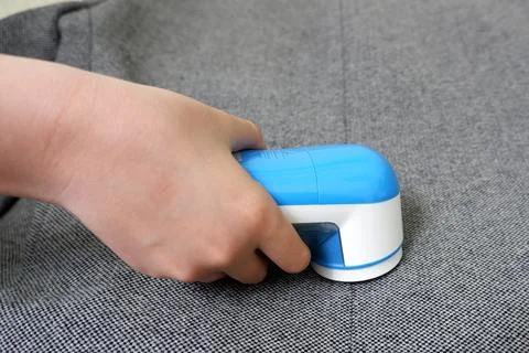 Removing pellets on clothing. Machine to remove the pellets Stock Photos