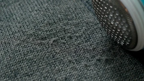 Removing pellets from cotton wool jacket Stock Footage 102028343