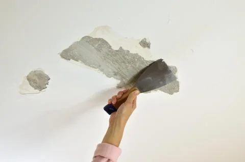 Removing Plaster with a Spatula Stock Photos