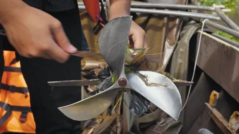 Removing Plastic from Boat s Propeller in the Mekong, Vietnam Stock Footage 284767811