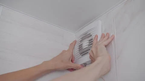 Removing Plastic Vent Cover for Bathroom Exhaust Fan Maintenance Video stock 341396857
