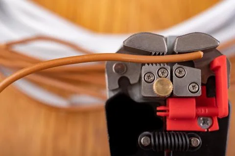 Removing protective insulation from electrical wires. Small work in the home  Stock Photos