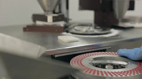 Removing the Rotary Disc Tray of an Encapsulation Machine Video stock 68643100