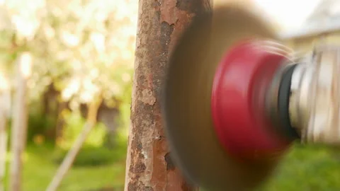 Removing rust and old paint from meta pipel with Angle Grinder Stock Footage 154299377
