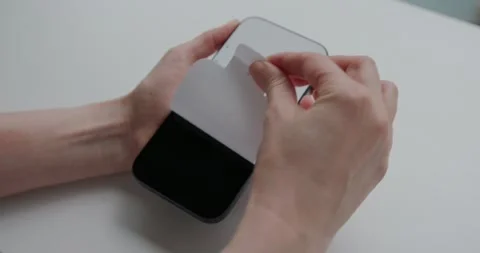 Removing screen protector from new iPhone. Warsaw, Poland - September 28, 2025 Stock Footage 318305264