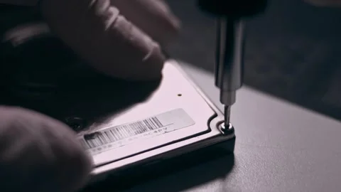 Removing the screw from hard disk drive with a screwdriver Stock Footage 324360325