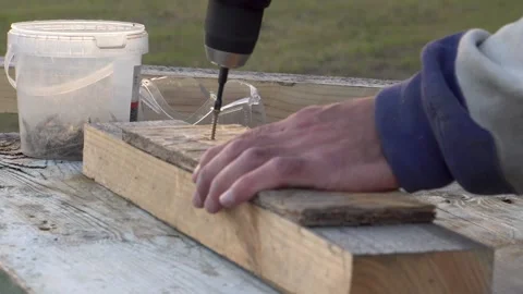 Removing screws from a board 4K Stock Footage 294050513