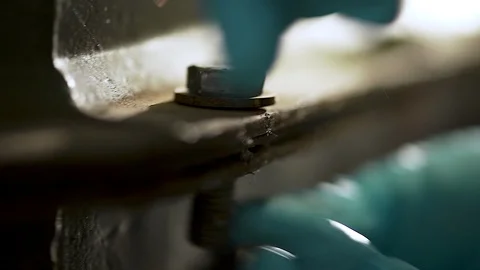 Removing screws by a worker. Stock Footage 111779363