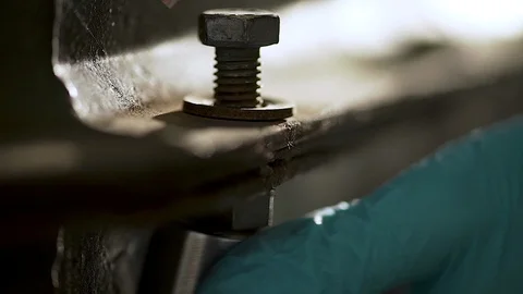 Removing screws by a worker with torque wrench. Video stock 111779138