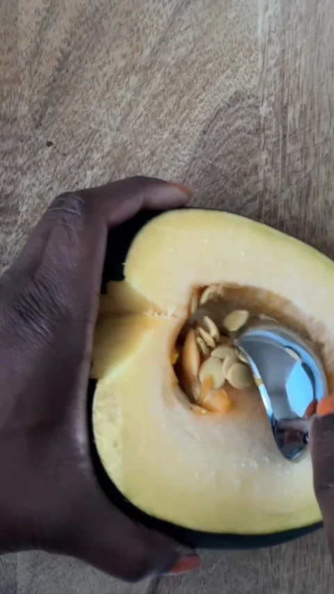 Removing seeds from an acorn squash Stock-Footage 289689899