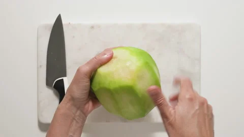 Removing seeds from melon. Fruit salad recipe Stock Footage 136713058