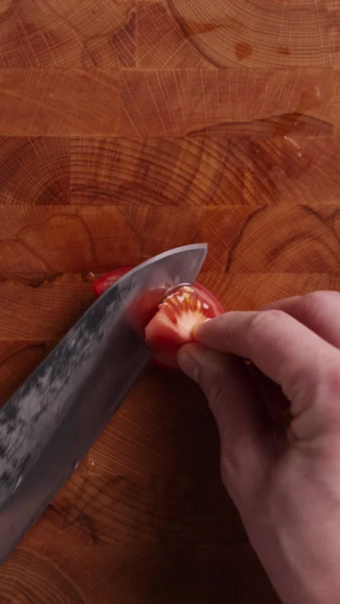 Removing Seeds from Tomato Vertical Top View Видео 336573283