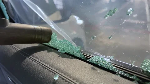 Removing sharp broken glass fragments from a car door Stock Footage 321480570