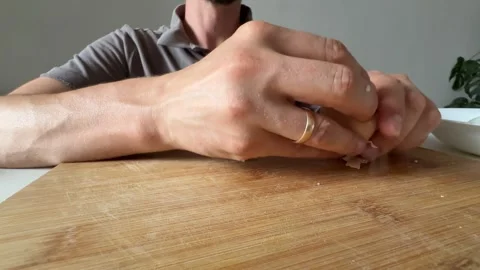 Removing shell from boiled egg by hand during meal preparation Stock Footage 337482429