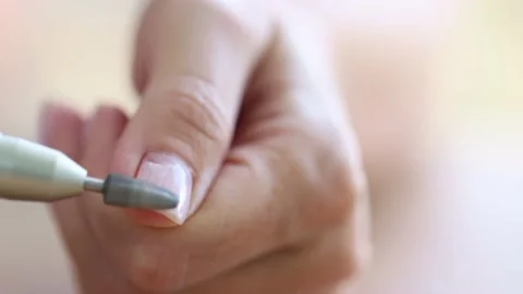 Removing shellac from the nails with fraser. Closeup. Selective focus. 4K Stock Footage 221886772