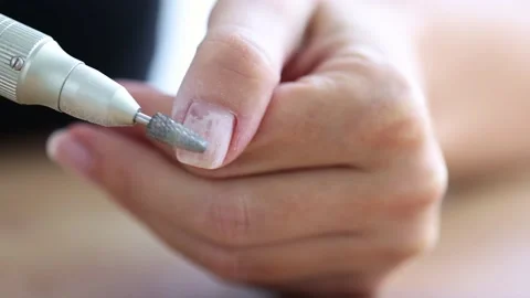 Removing shellac from the nails with fraser. Closeup. Selective focus. 4K Stock Footage 223314165