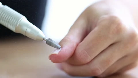 Removing shellac from the nails with fraser. Closeup. Selective focus. 4K Stock Footage 227576901