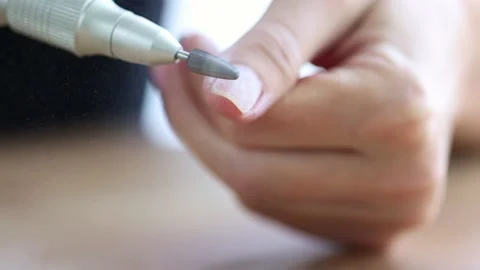 Removing shellac from the nails with fraser. Closeup. Selective focus. 4K Stock Footage 230625402