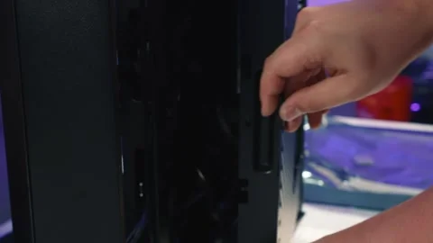 Removing side panel of desktop computer case after unscrewing screws Stock Footage 328984506